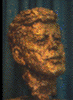 Bronze bust of John Fitzgerald Kennedy by artist Robert Berks, 1969, approx. 16 inches tall (photograph, 8-bit color, GIF87 format, 100 pixels high, 73 pixels wide, 5880 bytes)