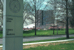 National Library of Medicine complex, looking west from Rockville Pike, Spring (photograph, 8-bit color, GIF87 format, 100 pixels high, 149 pixels wide, 11927 bytes)